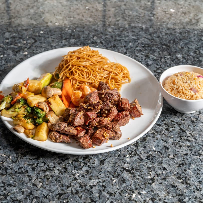 Kabuki Japanese Cuisine's hibachi steak, noodles, and vegetables with a side of fried rice.